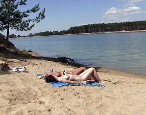 2 torrid russian maiden getting a suntan on the free beach.