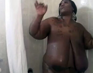 This Big dark-hued damsel jerks in the shower. Her ample