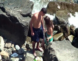 Teen fledgling duo attempts pummeling inbetween beach rocks